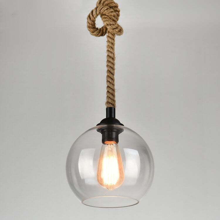 Pendelleuchte aus Glas in Kugelform mit Seilaufhängung