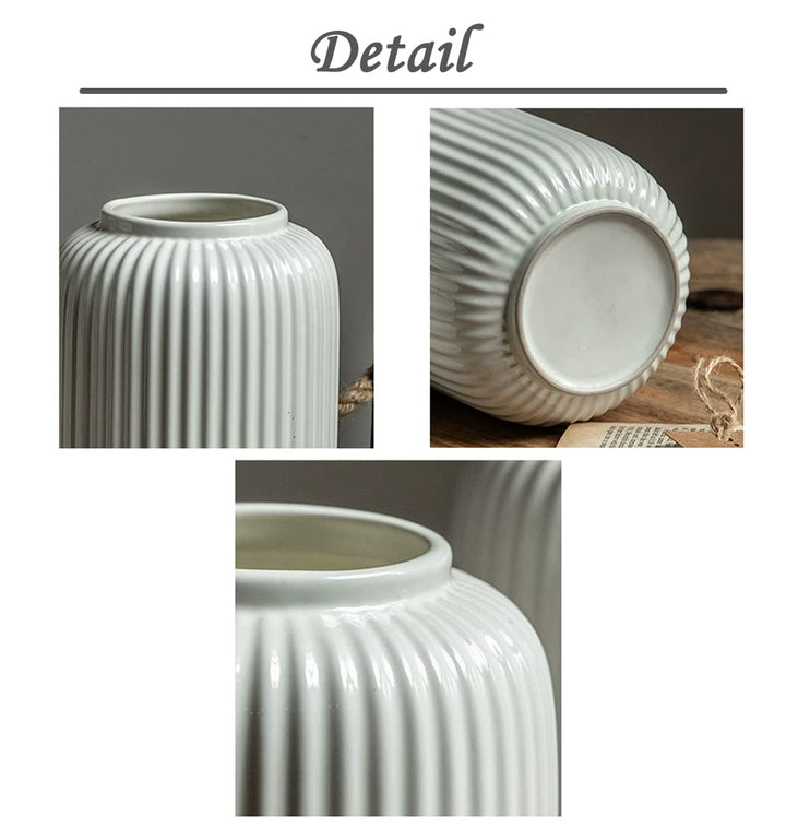 Glänzende weiße Vase neben dekorativen Wohnaccessoires