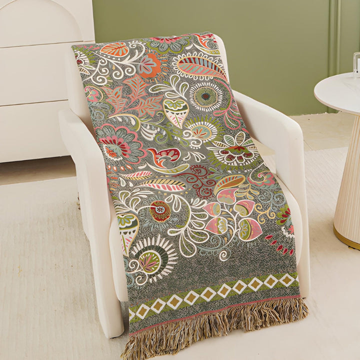 Baumwolldecke Boho – Wendeplaid mit floralem Muster und Fransen