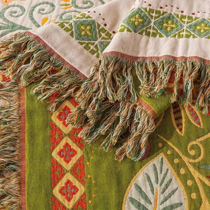 Baumwolldecke Boho – Wendeplaid mit floralem Muster und Fransen