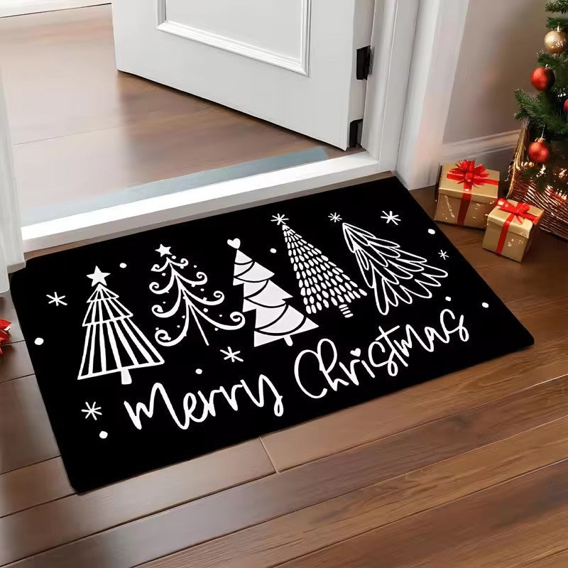 Weihnachts-Fußmatte vor einer geschmückten Eingangstür