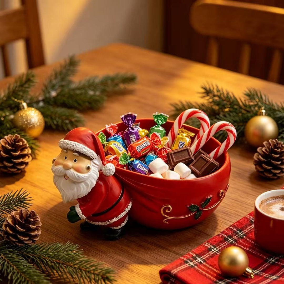 Dekorativer Weihnachtsschlitten mit Weihnachtsmann als festliche Tischdekoration
