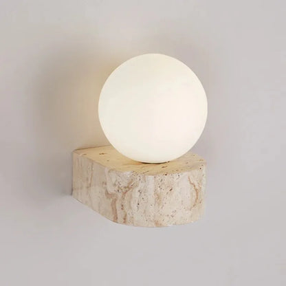 LED-Wandleuchte mit Steinsockel und Kugelglas für stilvolle Innenräume