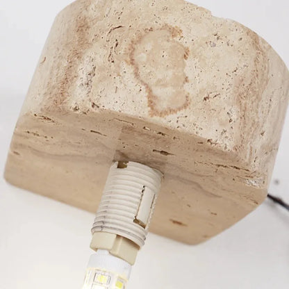 LED-Wandleuchte mit Steinsockel und Kugelglas für stilvolle Innenräume