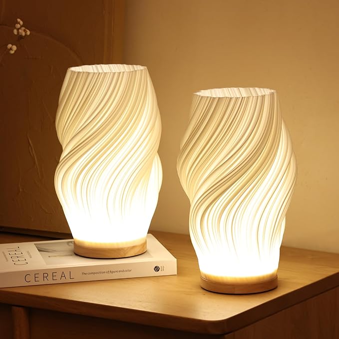 Minimalistische Tischlampe aus Kunststoff mit geschwungener Lichtsilhouette