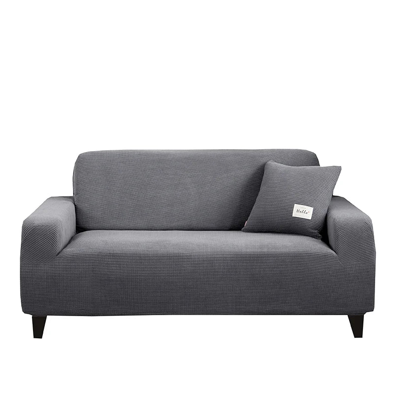 Wohnzimmer mit geschütztem Sofa durch dehnbaren Jacquard-Sofabezug