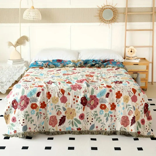 Baumwolldecke Boho – Wendeplaid mit Blumenmuster und Quasten
