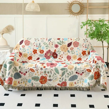 Baumwolldecke Boho – Wendeplaid mit Blumenmuster und Quasten