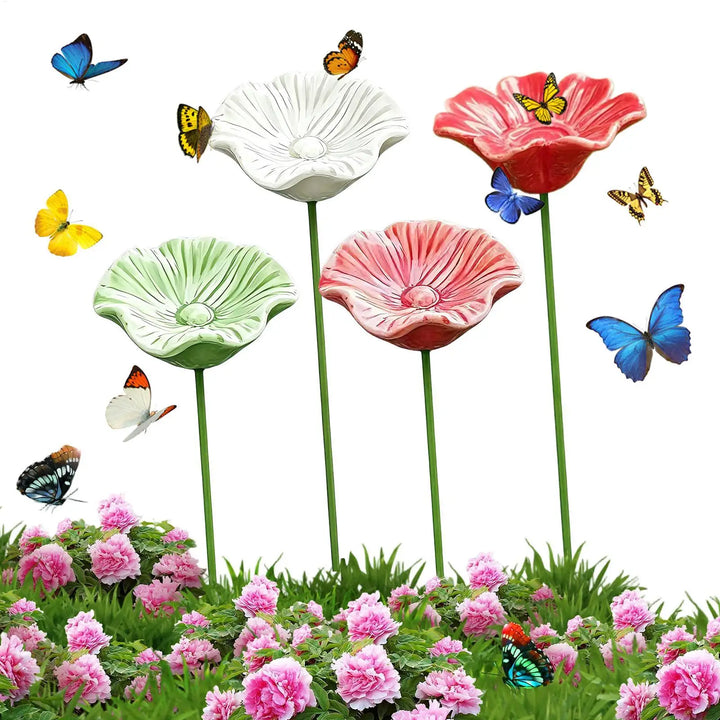 Vier Keramik-Bienenbäder im Blumendesign mit Metallspießen im Set